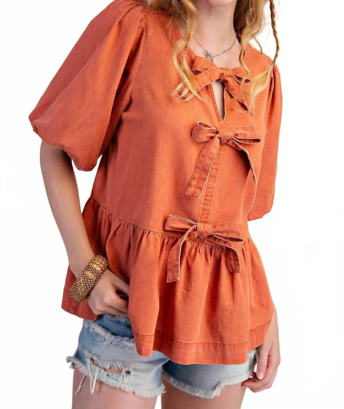 Easel peplum bow top