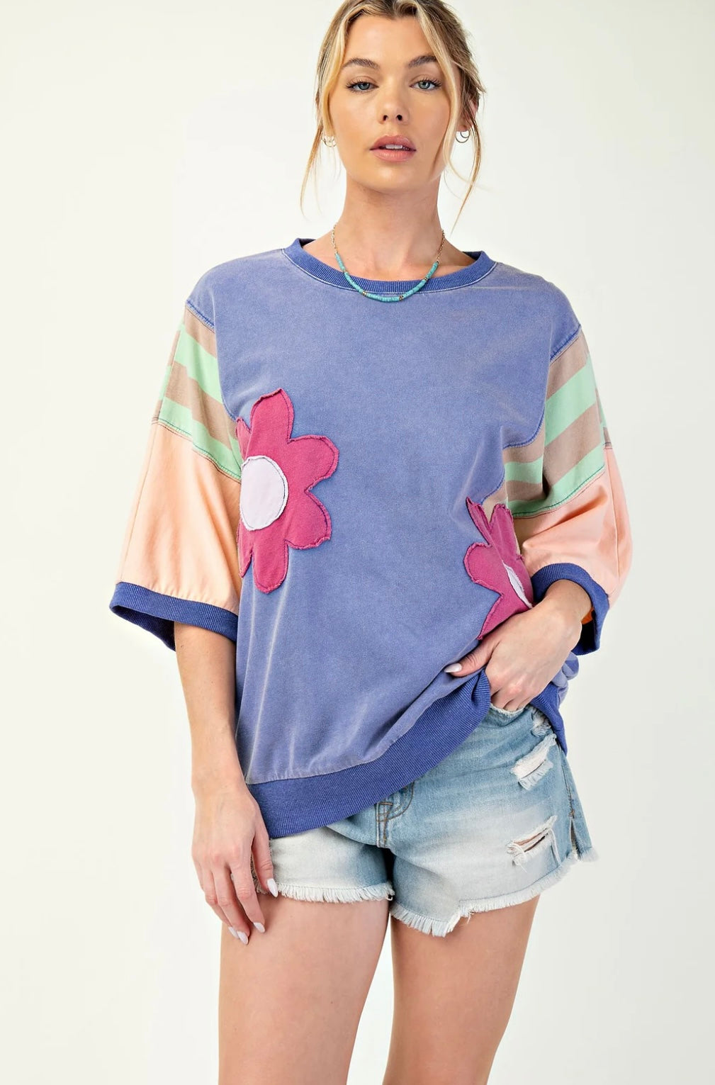 Easel knit color block top with flower patches