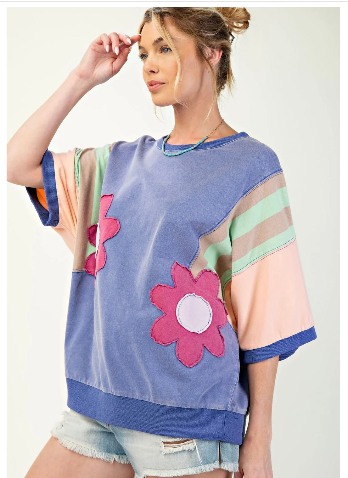 Easel knit color block top with flower patches